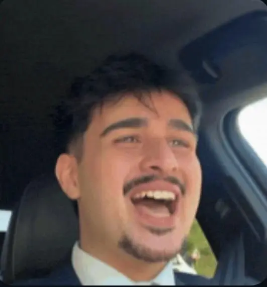 Deniz (Deniztalks) laughing in a car